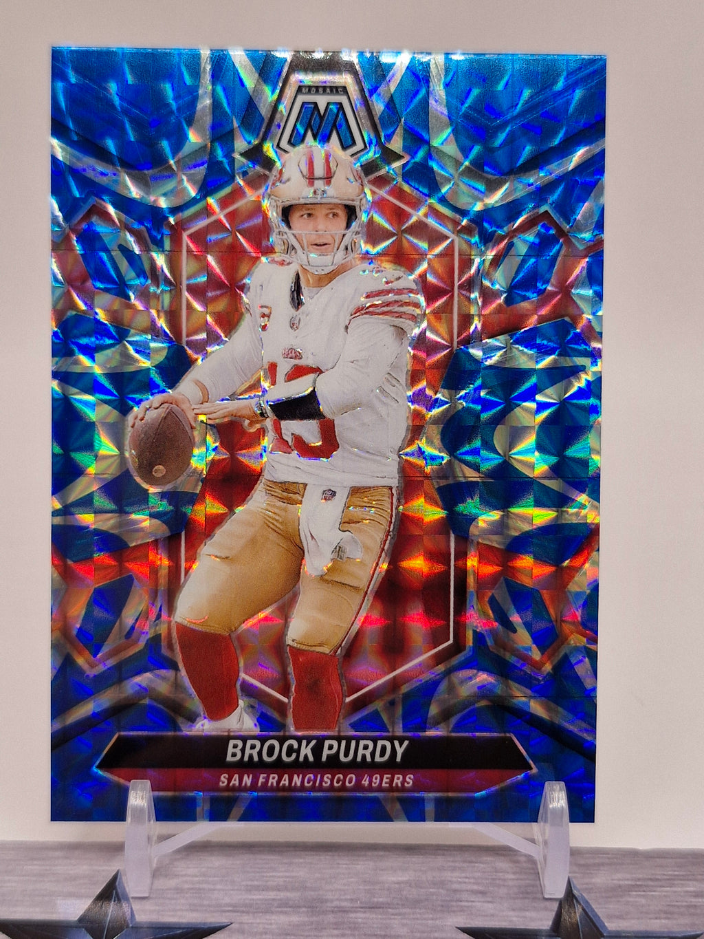 2024 Panini Mosaic #190 Brock Purdy Mosaic Reactive Blue