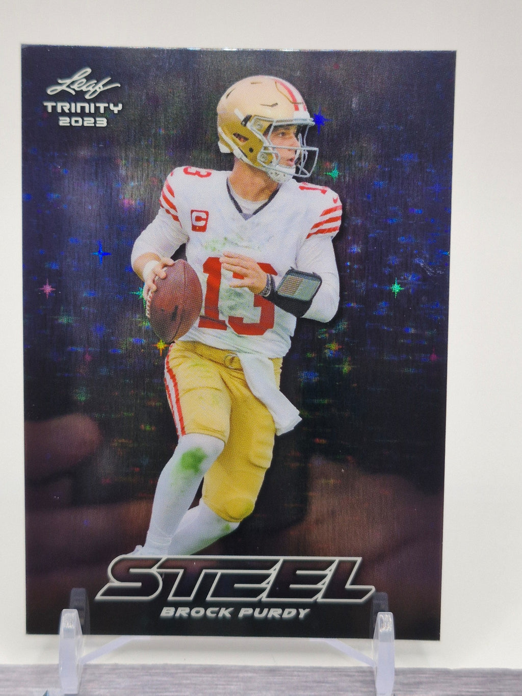 2023 Leaf Trinity (Mega Box) #S-15 Brock Purdy Steel Stars and Dots Blue #/99