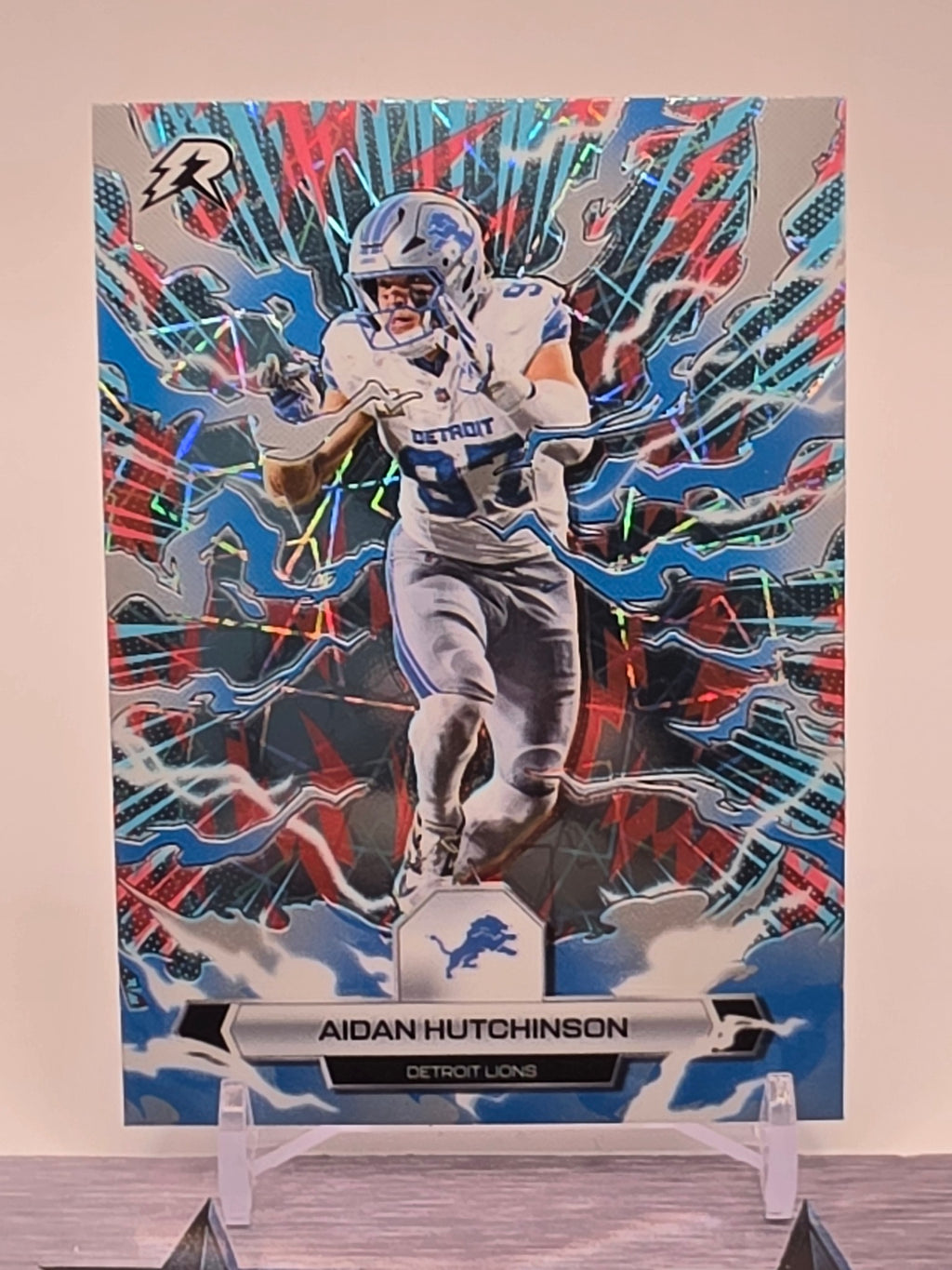 2025 Topps Resurgence #34 Aidan Hutchinson Sky Blue & Pink Shock Refractor