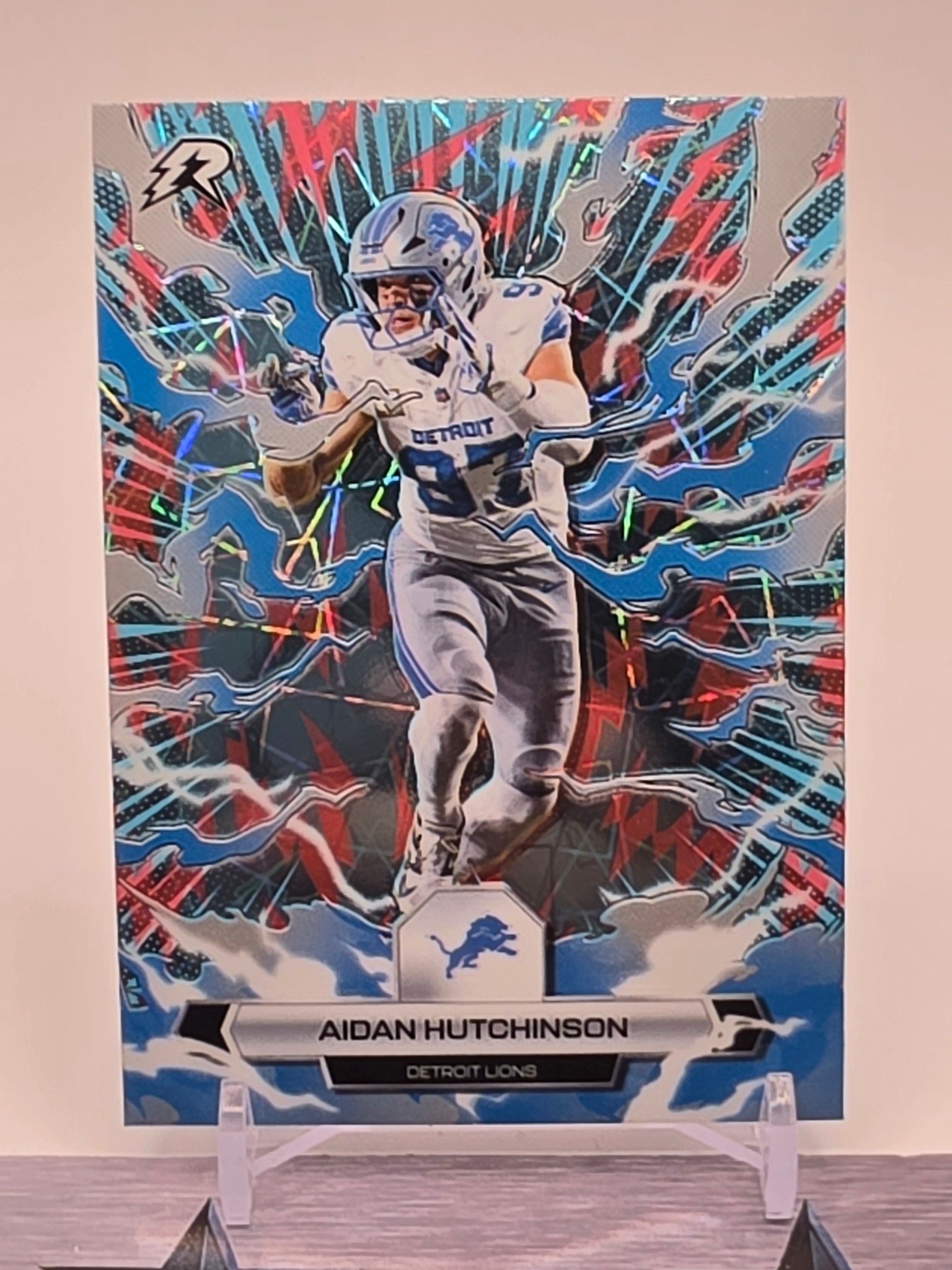 2025 Topps Resurgence #34 Aidan Hutchinson Sky Blue & Pink Shock Refractor