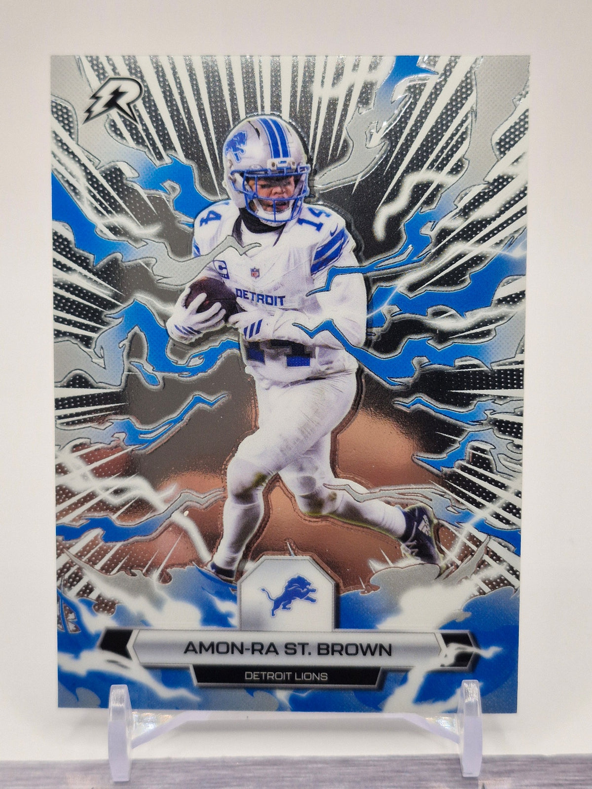 2025 Topps Resurgence #32 Amon-Ra St. Brown Sky Blue & Pink Shock Refractor